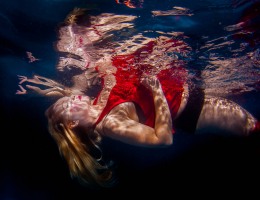 underwater model red dress surface