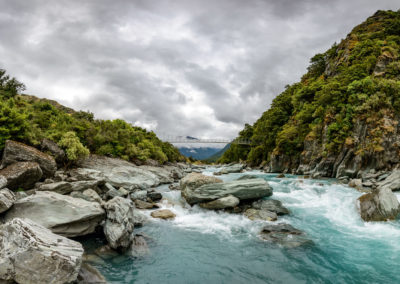 Blue water of the Matukituki River in Mount Aspiring National Park, New Zealand