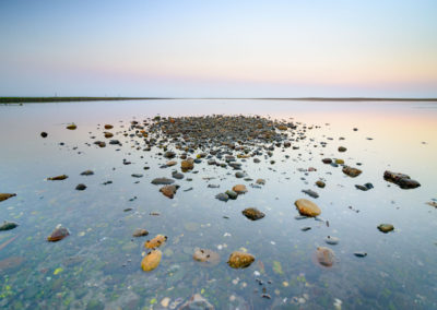 rocks in water during sublime sunset