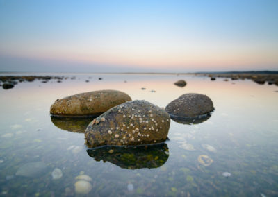 rocks in water during sublime sunset